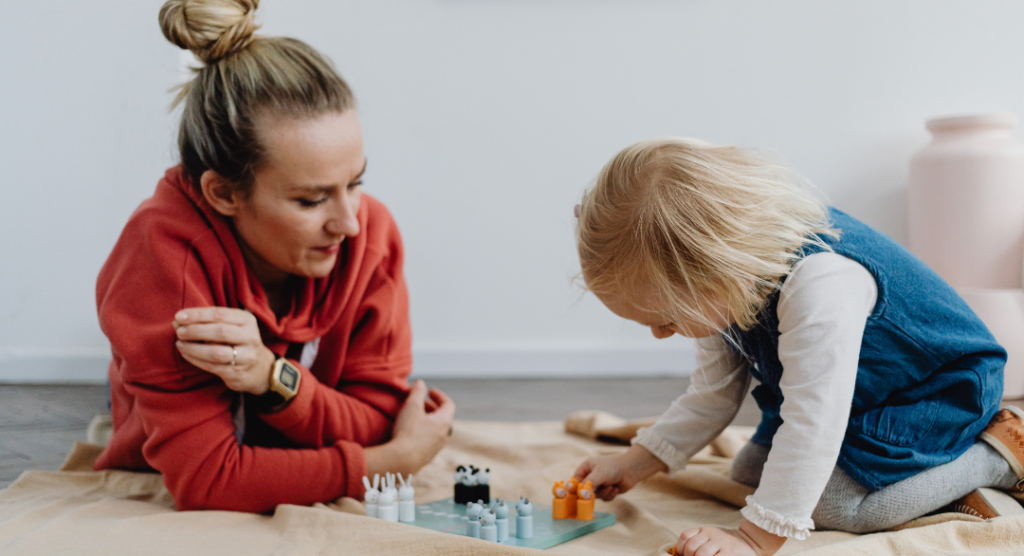 Child working with a therapist using play-based therapy techniques during a counseling session