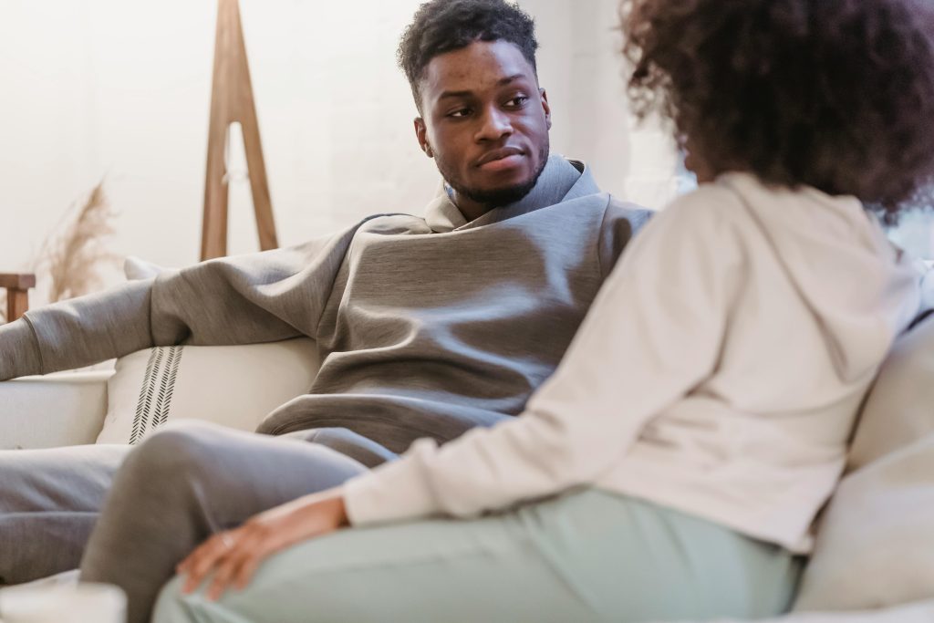 Do I Need Couples Therapy or Individual Therapy? Take This Quiz - Resolutions Therapy Couple talking together — deciding between couples therapy and individual therapy as a first step