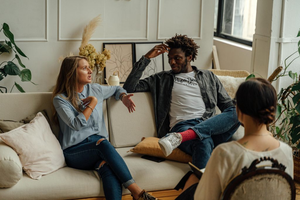 Do I Need Couples Therapy or Individual Therapy? Take This Quiz - Resolutions Therapy Couple sitting with their therapist during a couples therapy session